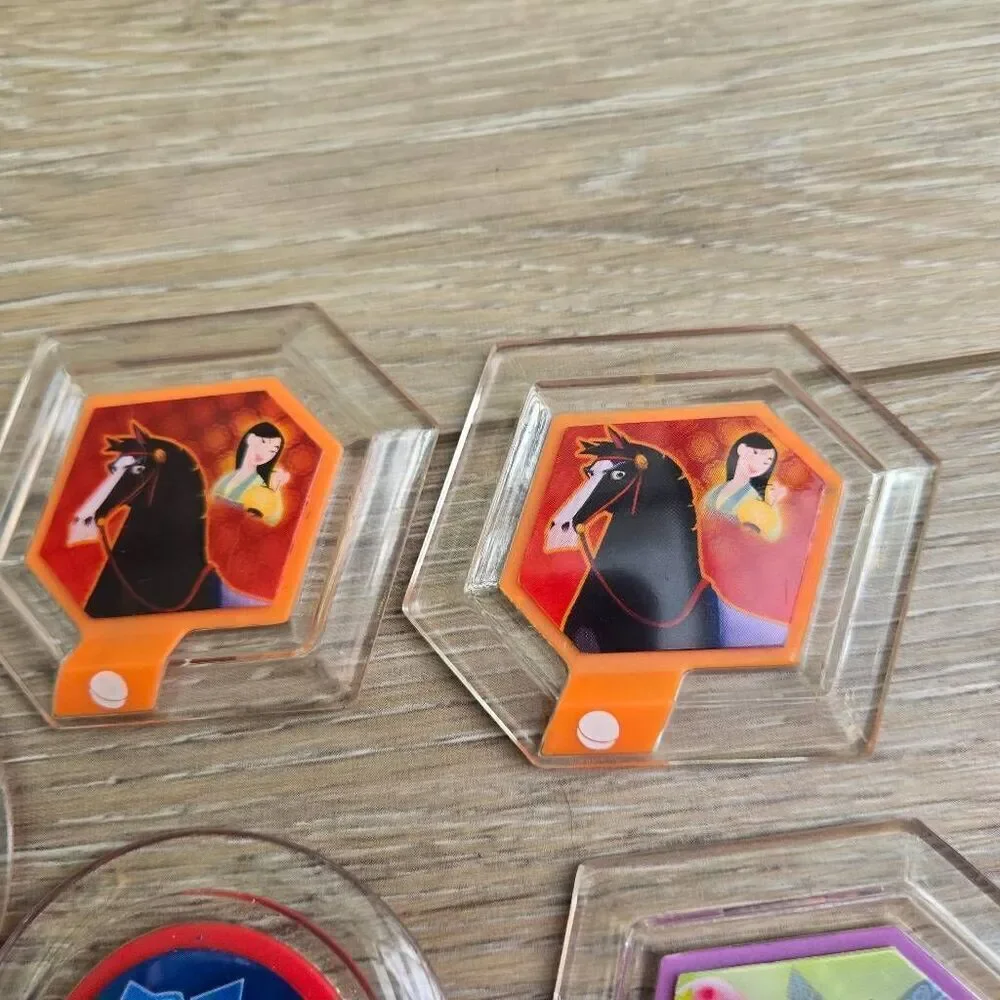 Disney Infinity power disc's lot of 11 Mulan, mickey, rapunzel, Alice, Nemo, car